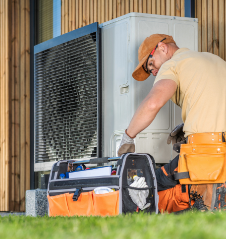 Professional heating engineer working on a boiler