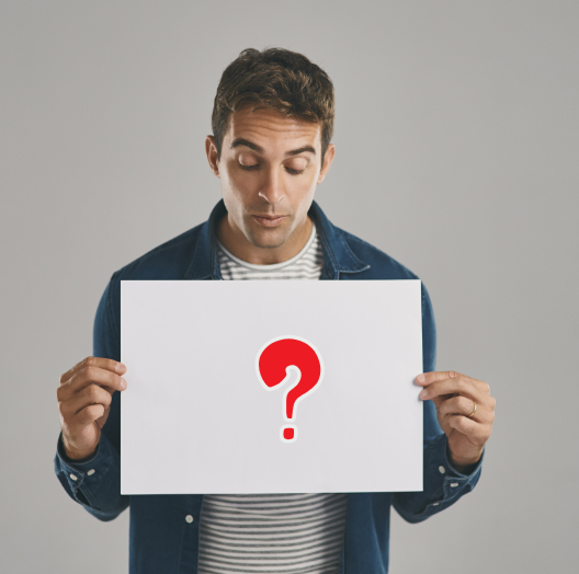 Man holding a question mark sign